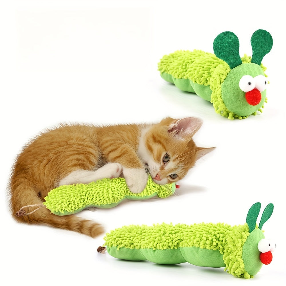 Kitten playing with green caterpillar interactive plush cat toy